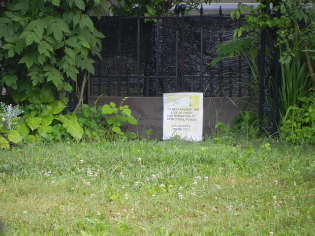 Enclosure with board across opening.