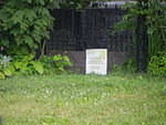 Enclosure with board across opening.